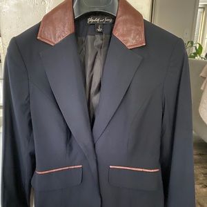 Elizabeth and James navy blazer with brown leather details.